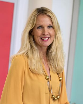 Frances Valintine, founder of Tech Futures Lab - blonde woman wearing a dark yellow top