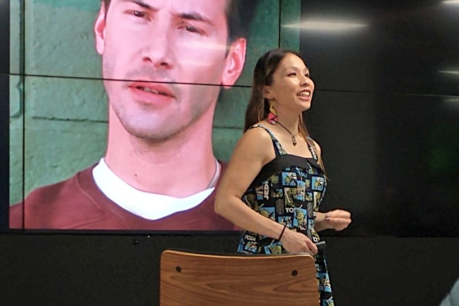 Photo of me with Keanu Reeves on the screen behind me
