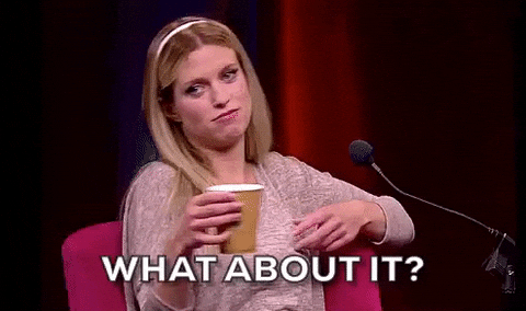 Gif of a blonde woman with a coffee cup in a pink top with the caption saying “What about it”. She is gesturing with her arms as if to ask “what about it”