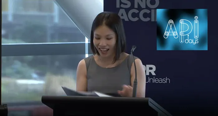 Me speaking at a podium. I have put the API Days logo superimposed to the right