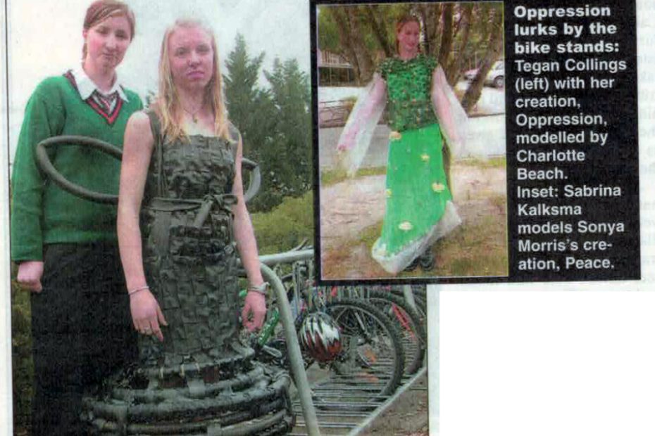 Photo from the Timaru Herald of two of the art works. The caption says "Oppression lurks by the bike stands: Tegan Collings (left) with her creation, Oppression, modelled by Charlotte Beach. Inset: Sabrina Kalksma models Sonya Morris' creation, Peace