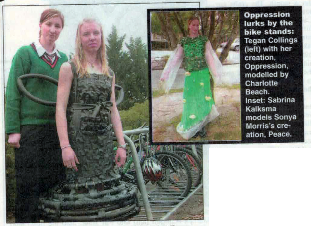 Photo from the Timaru Herald of two of the art works. The caption says "Oppression lurks by the bike stands: Tegan Collings (left) with her creation, Oppression, modelled by Charlotte Beach. Inset: Sabrina Kalksma models Sonya Morris' creation, Peace